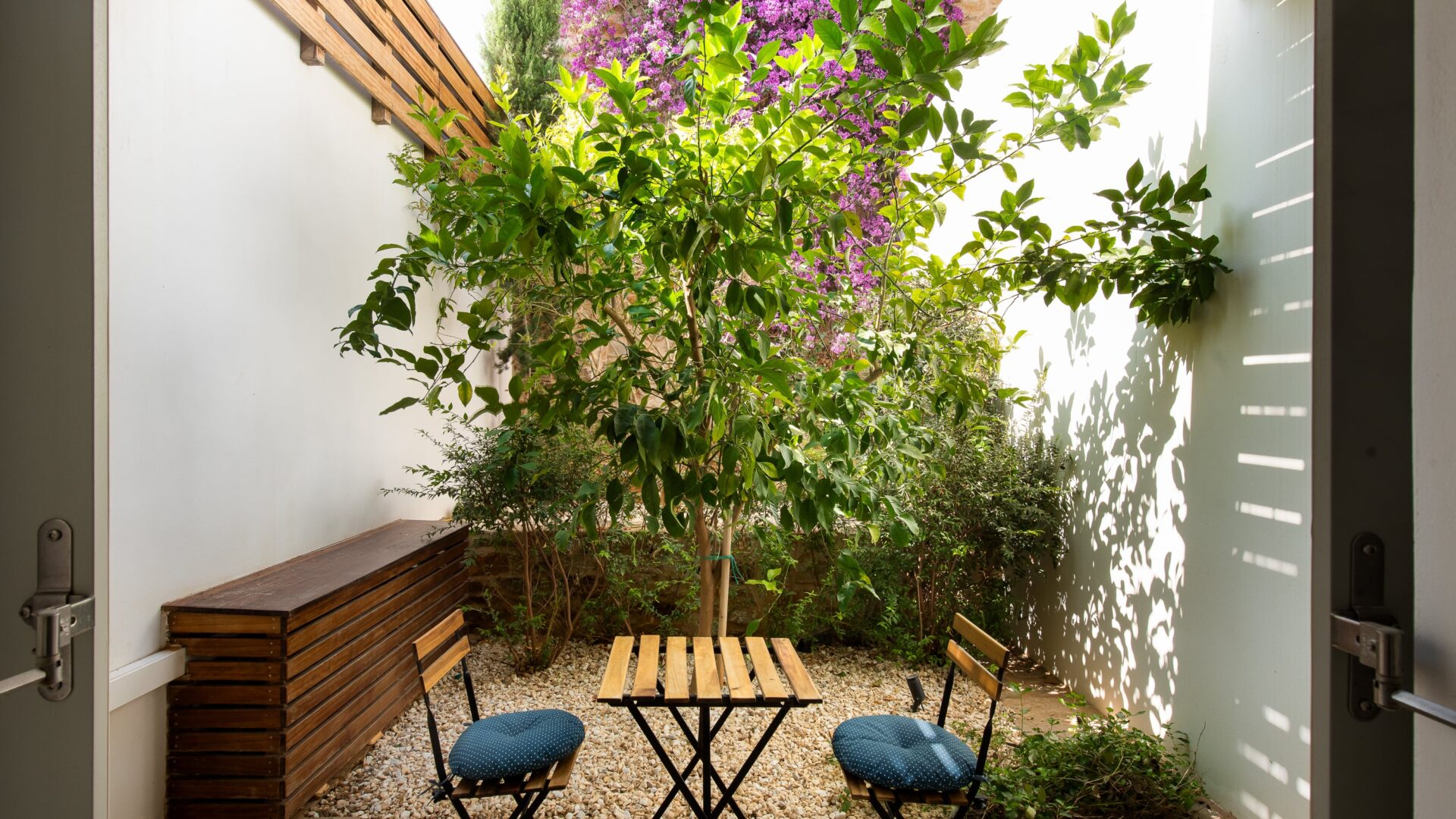 lower grnd master bdrm , porch & garden-min